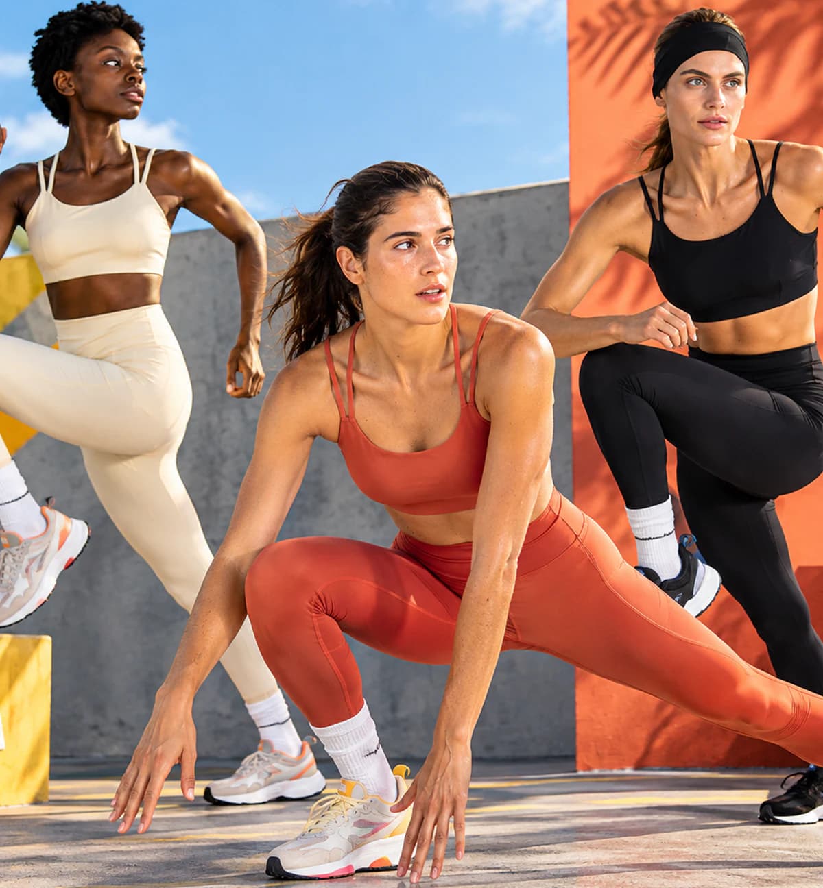 Athletes wearing performance sports bras and leggings during outdoor training