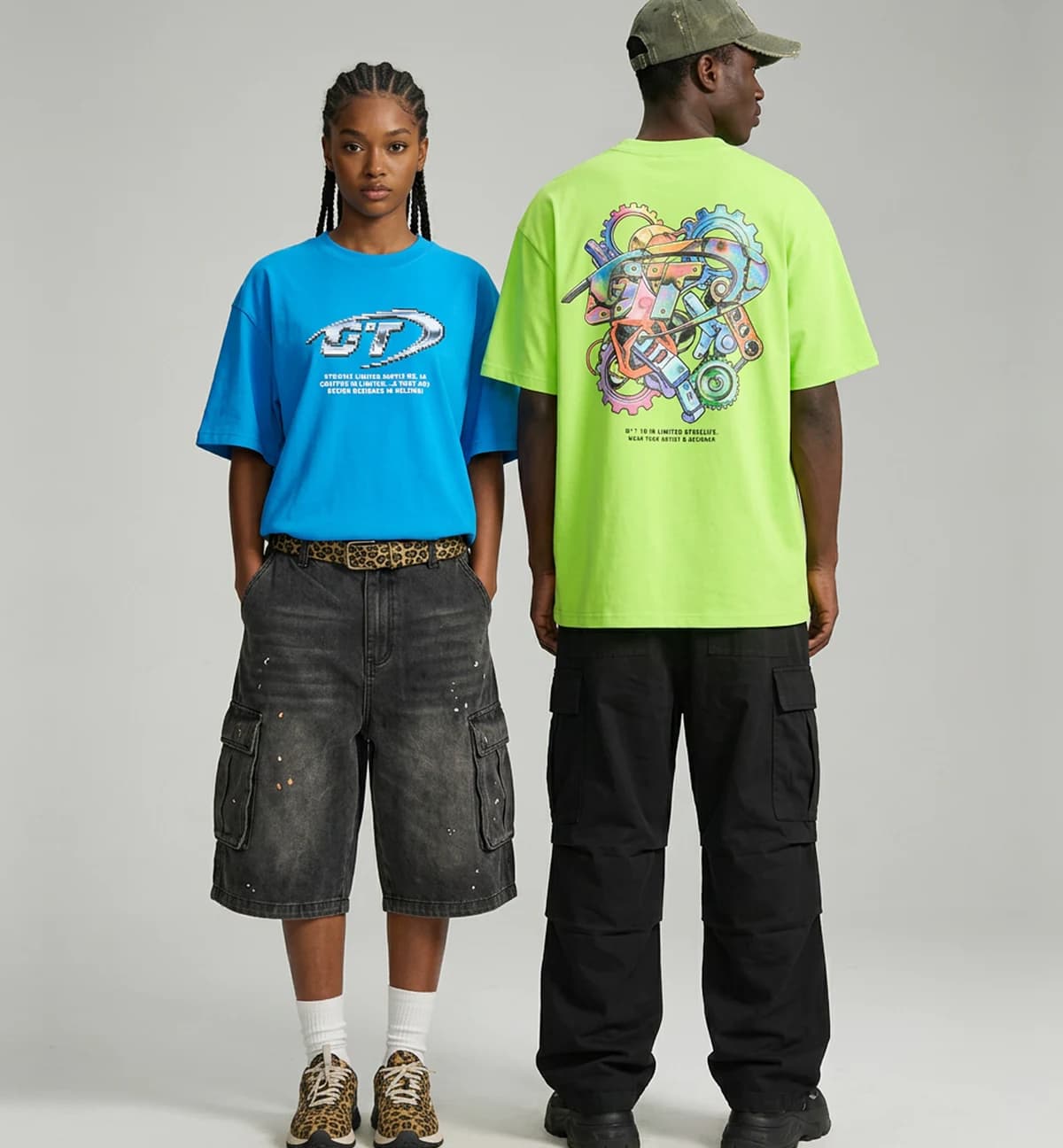 Models wearing graphic circular-knit T-shirts and casual cargo bottoms
